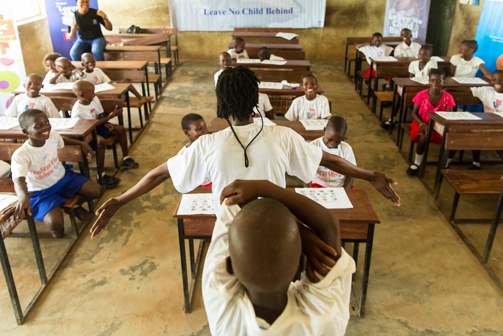 Picture of smiley little boys seated in their respective chairs